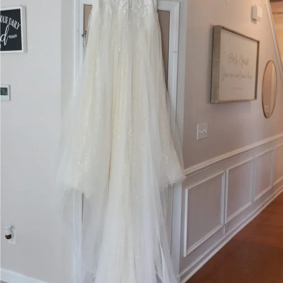 This wedding dress is a size 20. Brand New and had never been worn before.